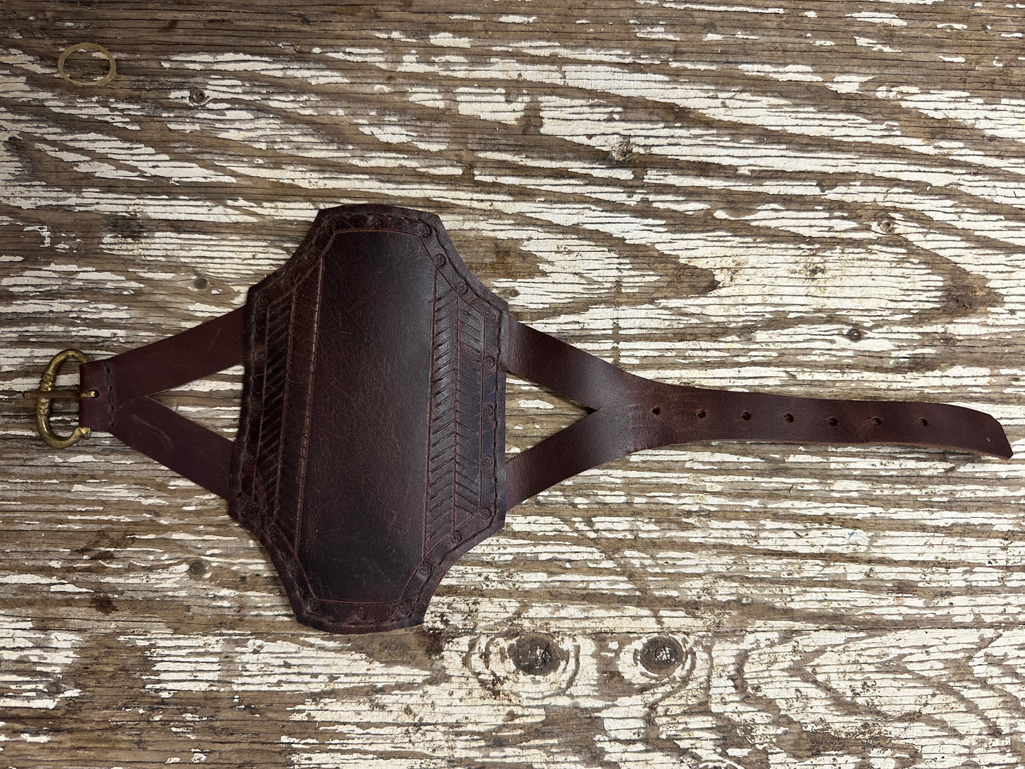 
                  
                    Rectangular archery bracer in brown
                  
                