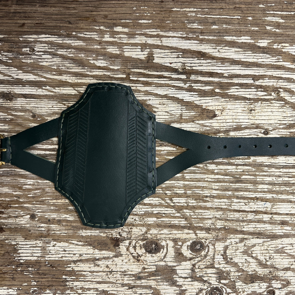 
                  
                    Rectangular archery bracer in green
                  
                