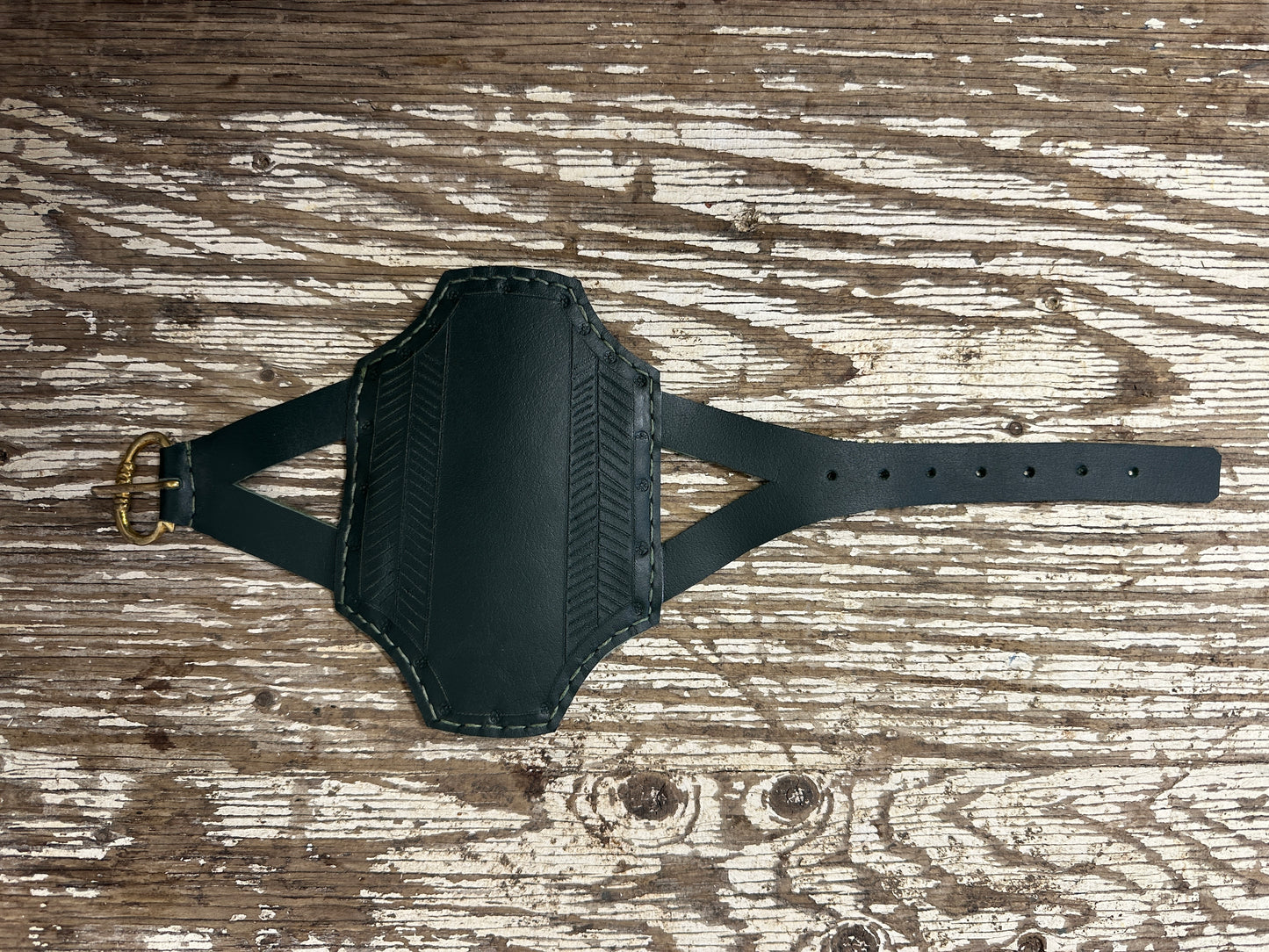 
                  
                    Rectangular archery bracer in green
                  
                