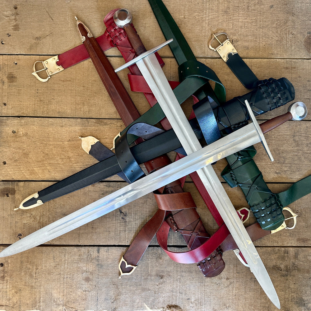 Type 13 Arming Sword. Two swords crossed on a pile of scabbards