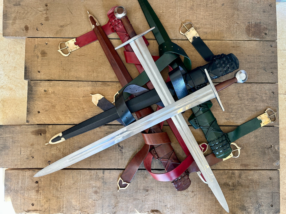 Type 13 Arming Sword. Two swords crossed on a pile of scabbards