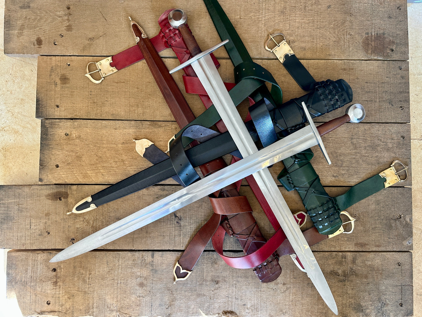 Type 13 Arming Sword. Two swords crossed on a pile of scabbards