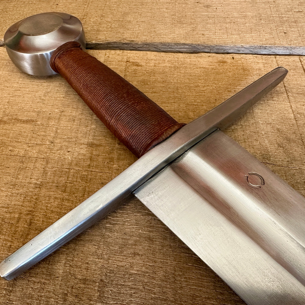 
                  
                    Type 13 Arming Sword showing a close up of the hilt
                  
                