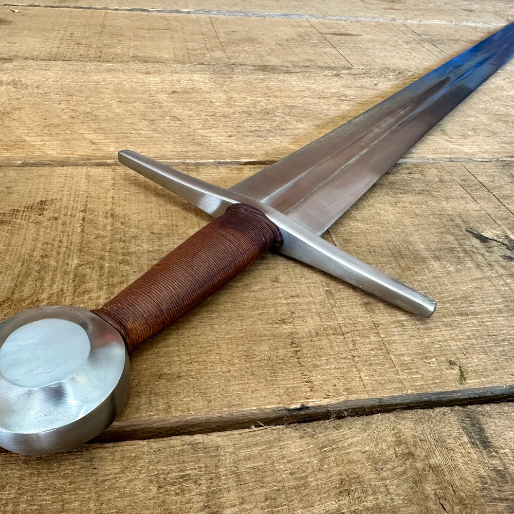 
                  
                    Shot of sword from pommel down
                  
                