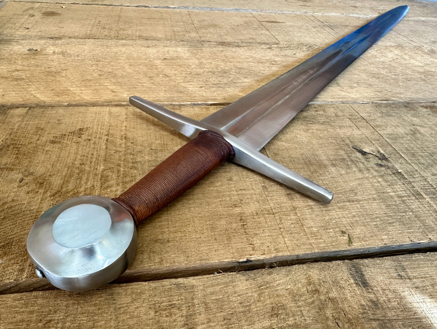 
                  
                    Shot of sword from pommel down
                  
                