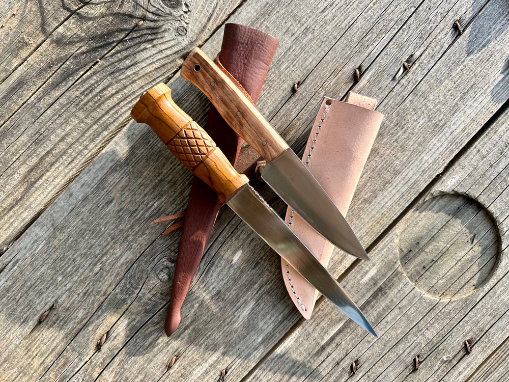 
                  
                    Tod Cutler Whittle tang dagger and field knife on sheathes
                  
                