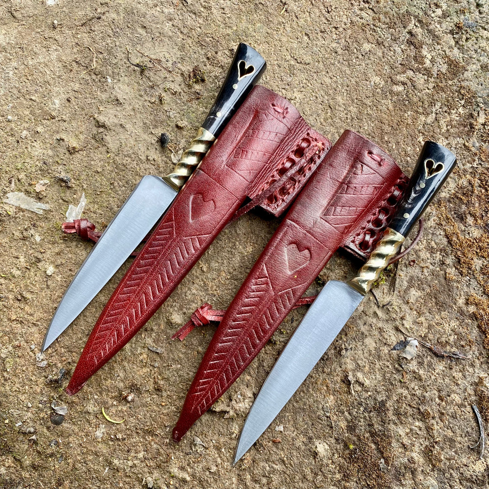 
                  
                    Pair of Tod Cutler heart eating knives 
                  
                