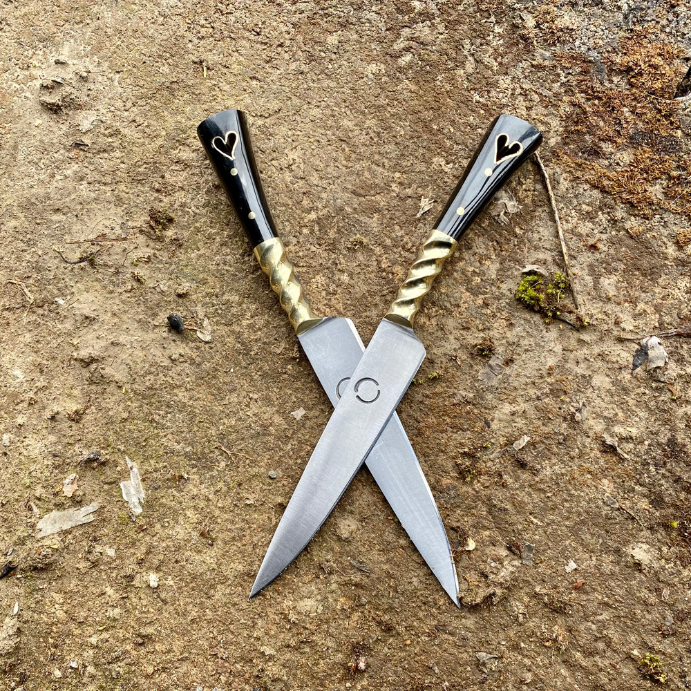 
                  
                    Pair of Tod Cutler heart eating knives 
                  
                