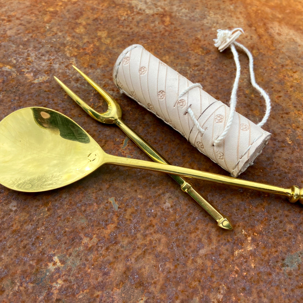
                  
                    Tod Cutler leather needle case, brass two tine fork and brass spoon
                  
                