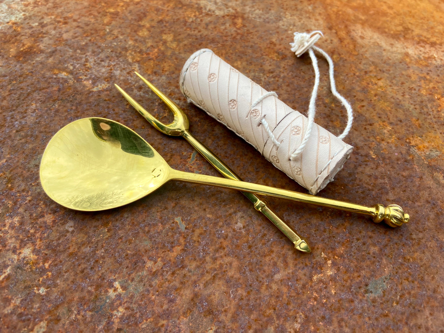 
                  
                    Tod Cutler leather needle case, brass two tine fork and brass spoon
                  
                